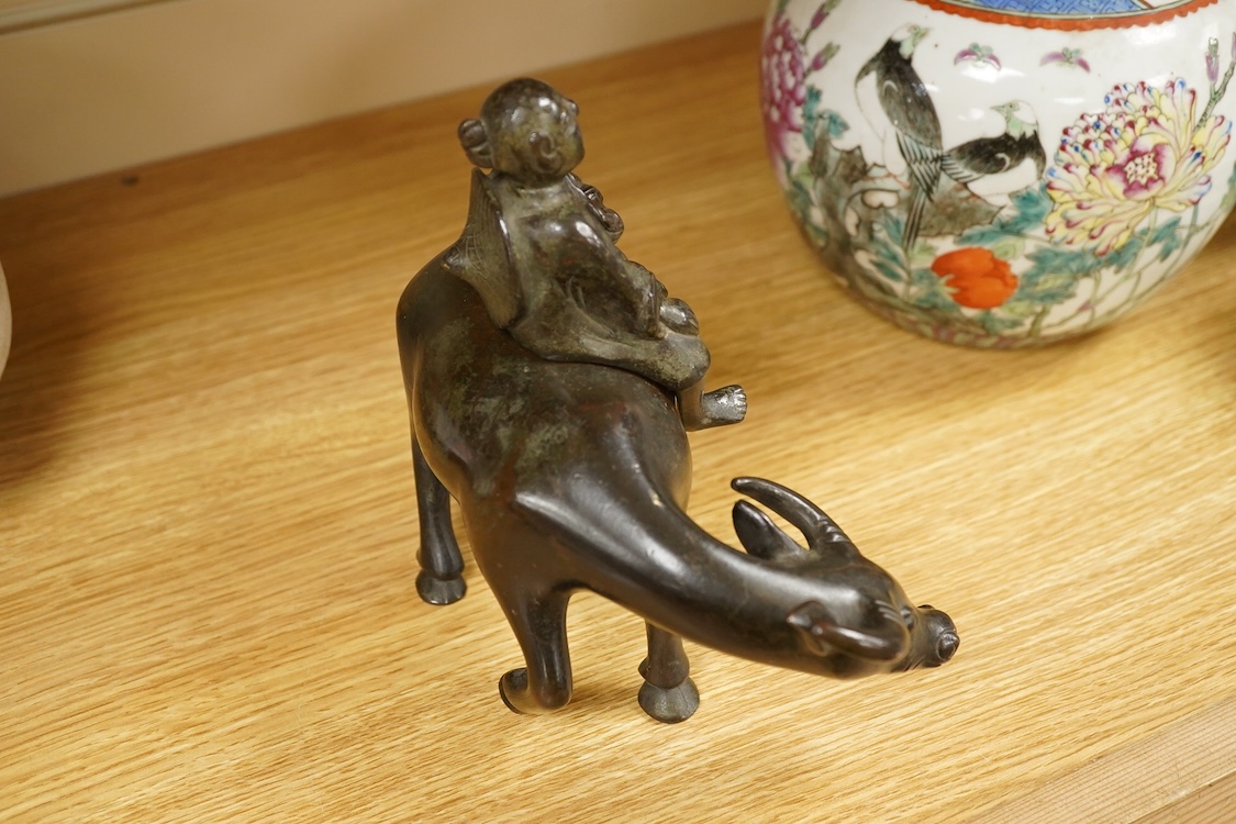 A Chinese bronze buffalo and figural incense burner, 18cm high